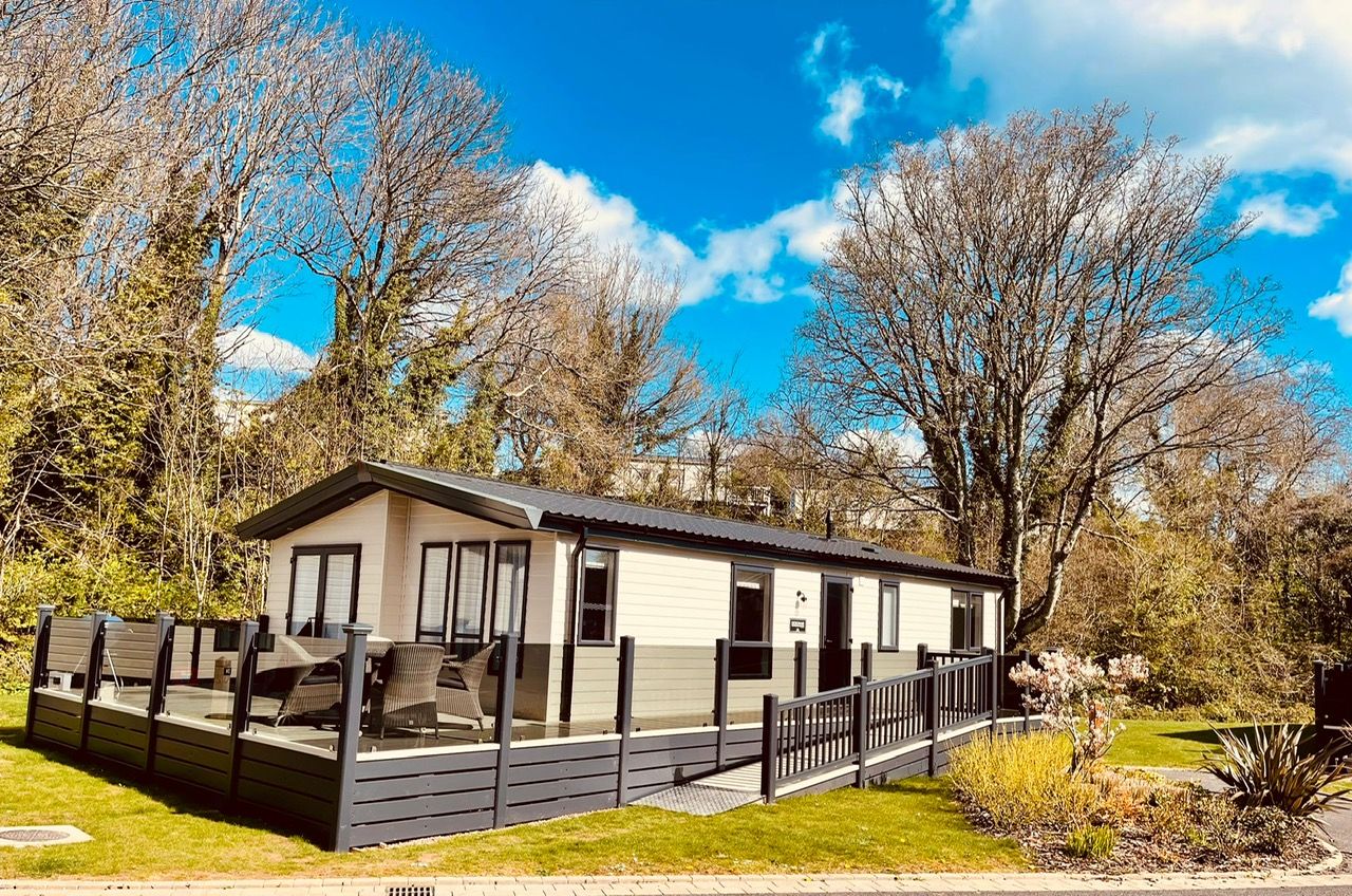 The lodge in spring sunshine with its ramp and decking